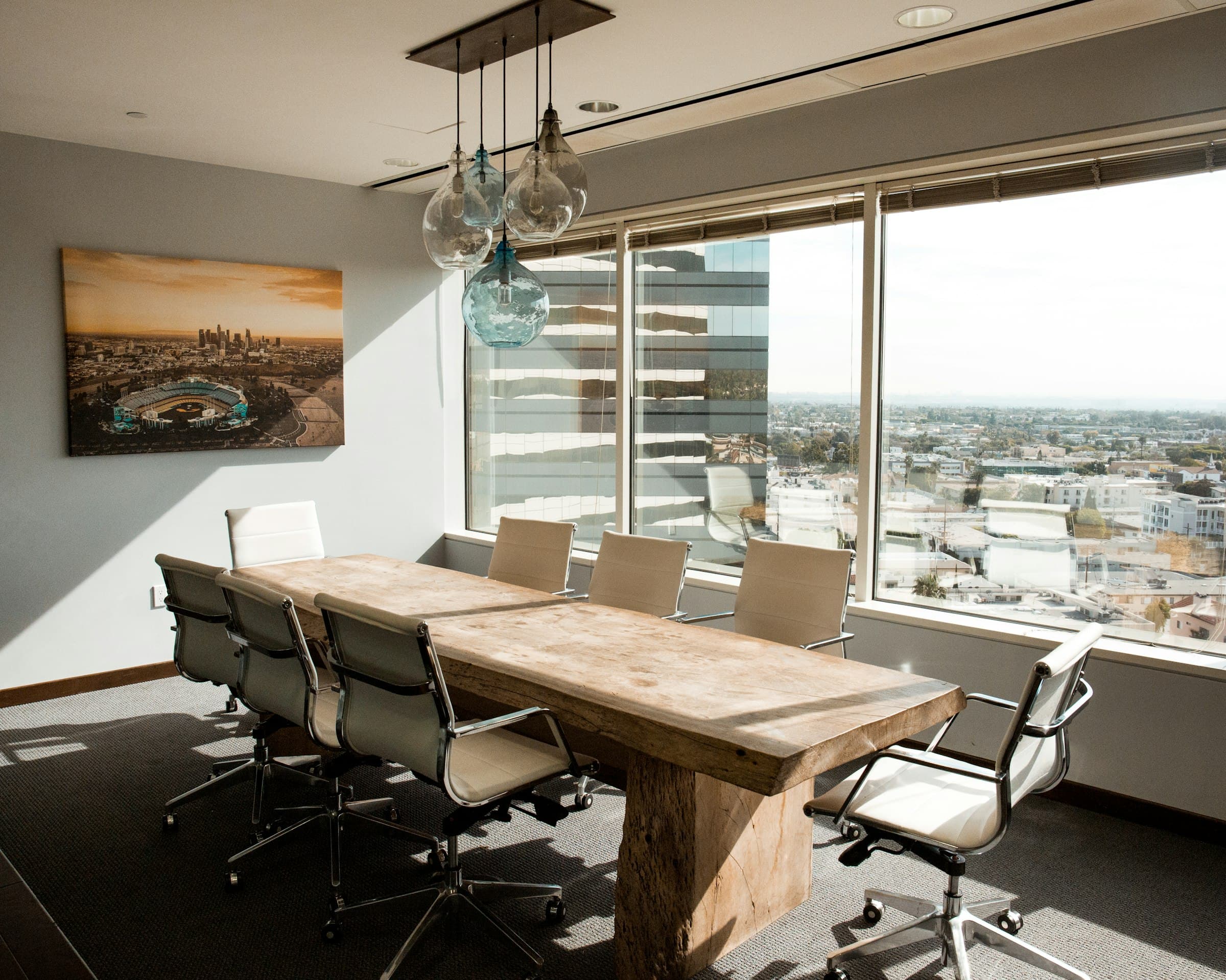 High-floor boardroom with long table and city view