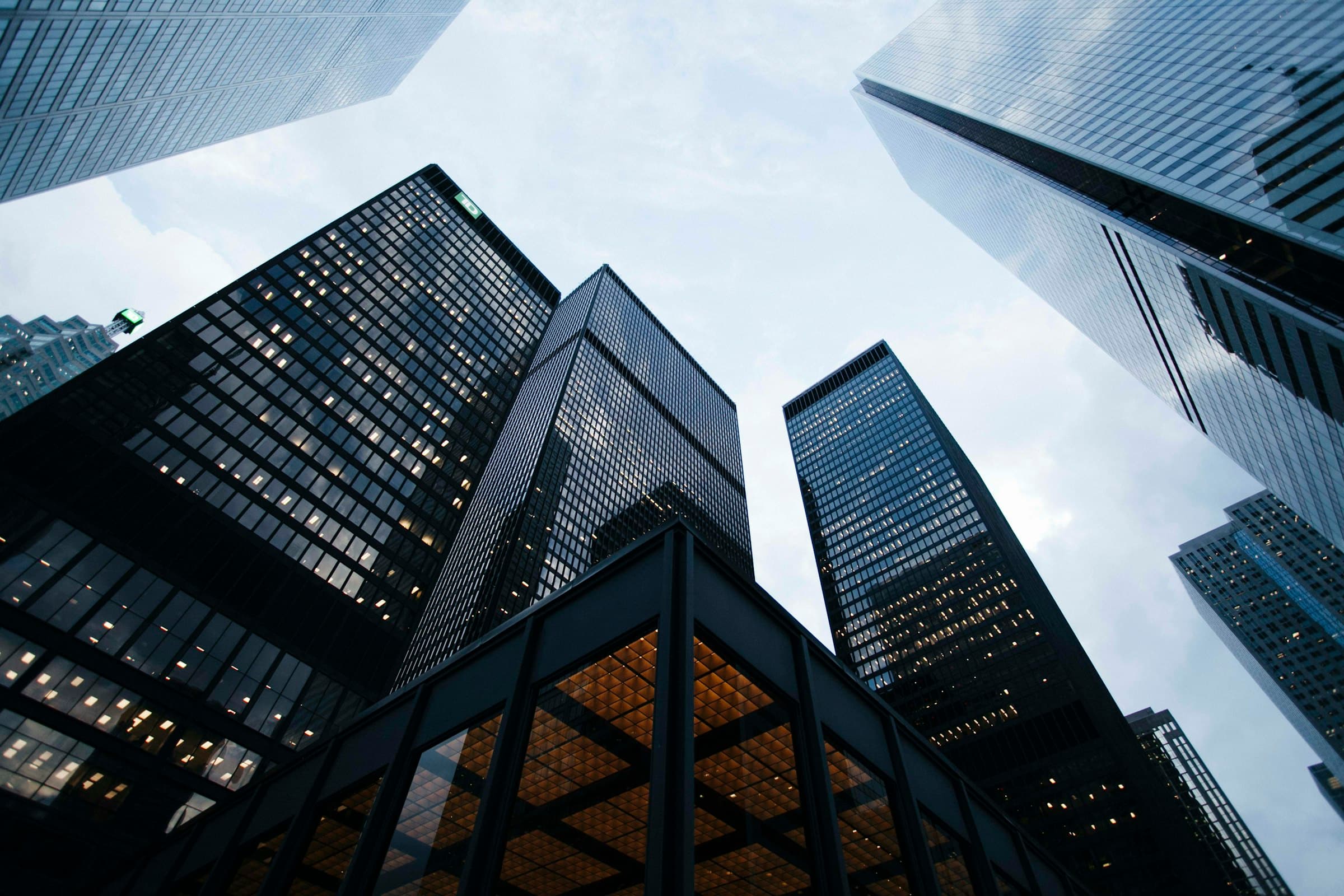 Financial-district glass office towers from below